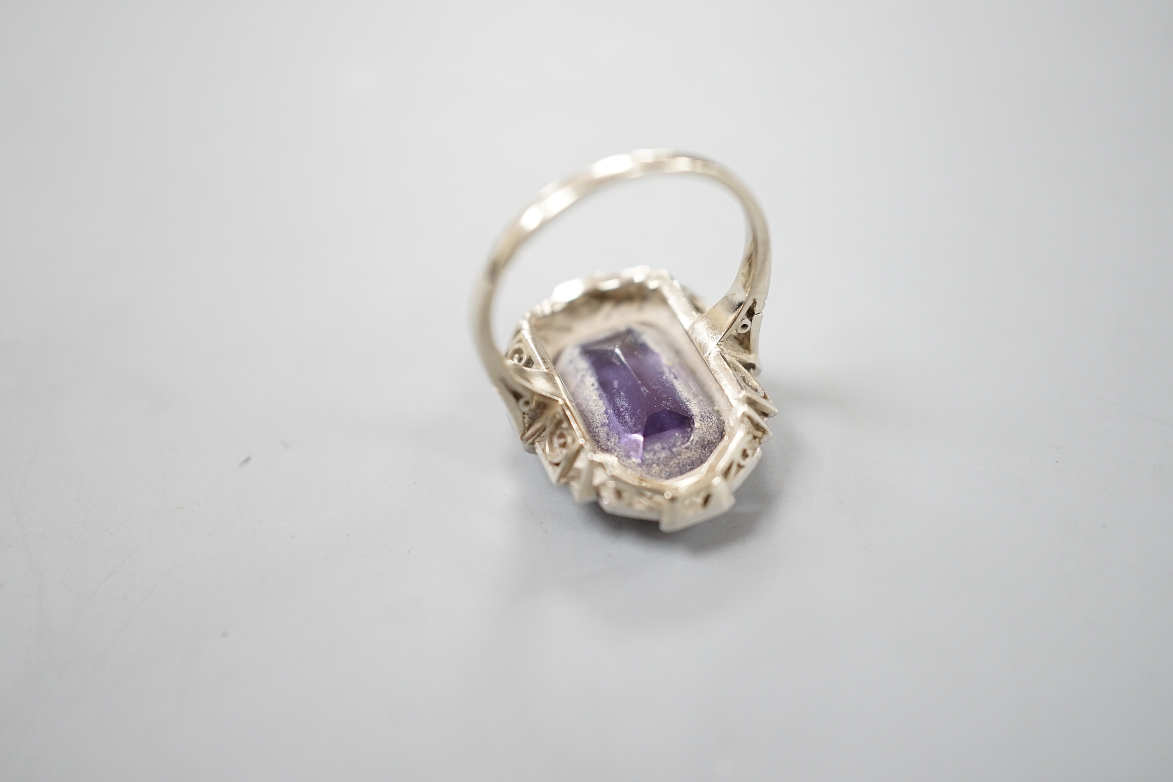 An Art Deco style white metal, synthetic colour change corundum and diamond chip set dress ring, size L/M, gross weight 5.6 grams.